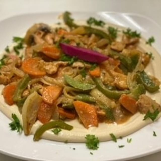 Hummus Topped with Chicken Shawarma Lunch.